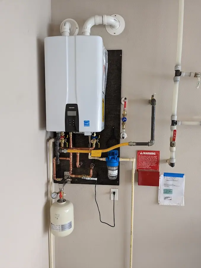 Professional plumber installing copper piping in a Sharonville home